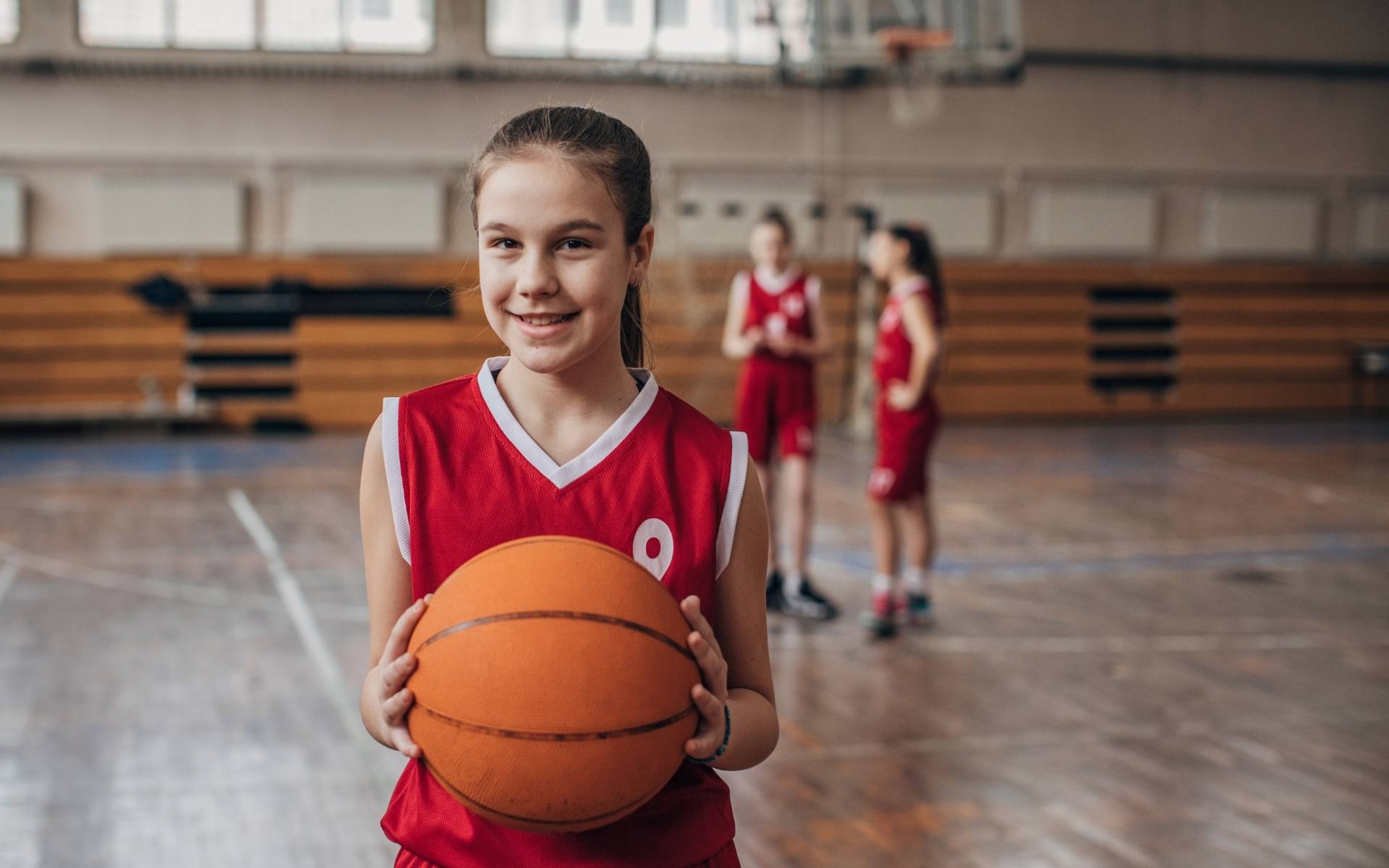 Girl with basketball — pediatric cardiac genetic screening