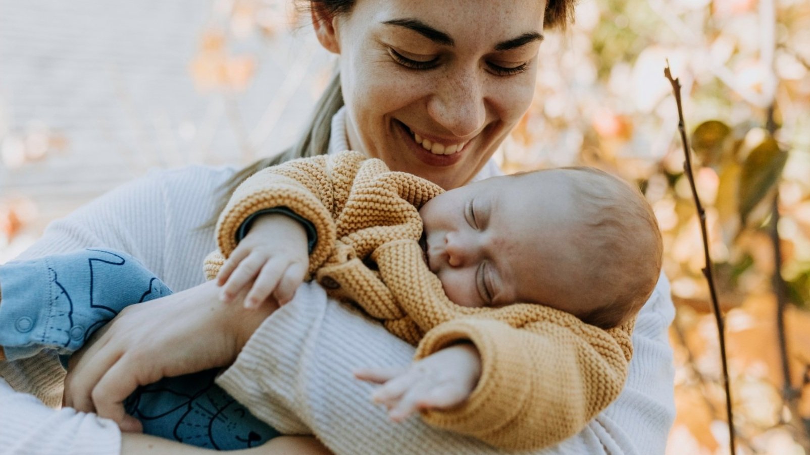 Parent holding child — pediatric genetic testing access for every family